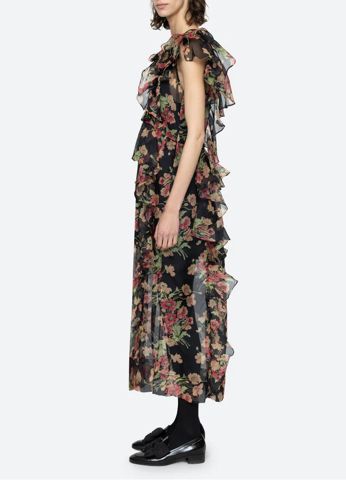 Woman wearing a floral dress on a white background