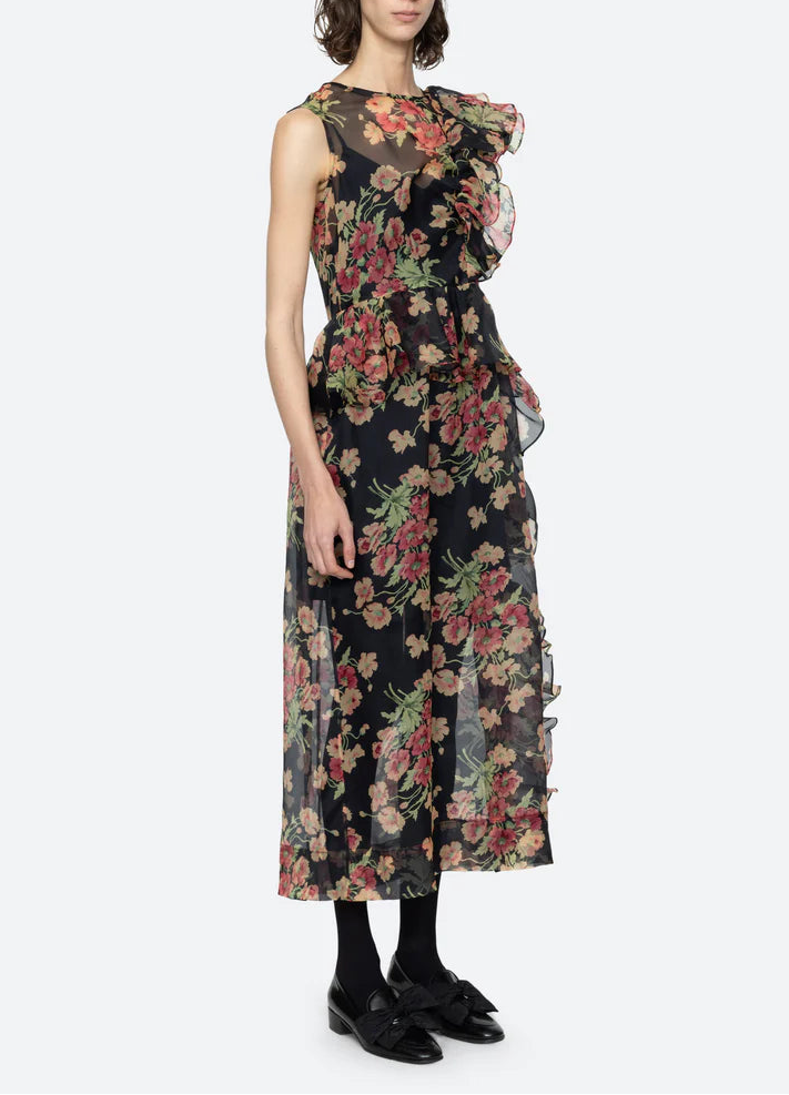 Woman wearing a floral dress on a white background