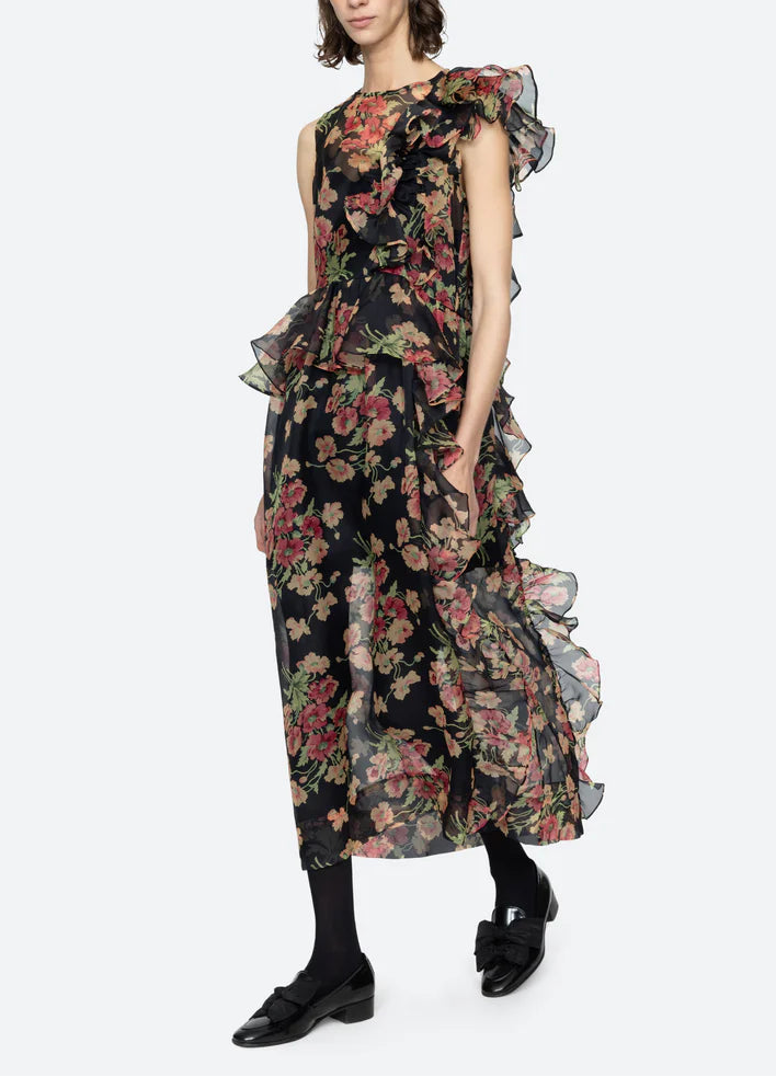 Woman wearing a floral dress on a white background
