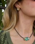 Regina Eye Studs on model with green top and neckace