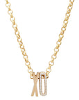 Gold necklace with 'XO' pendant on a white background