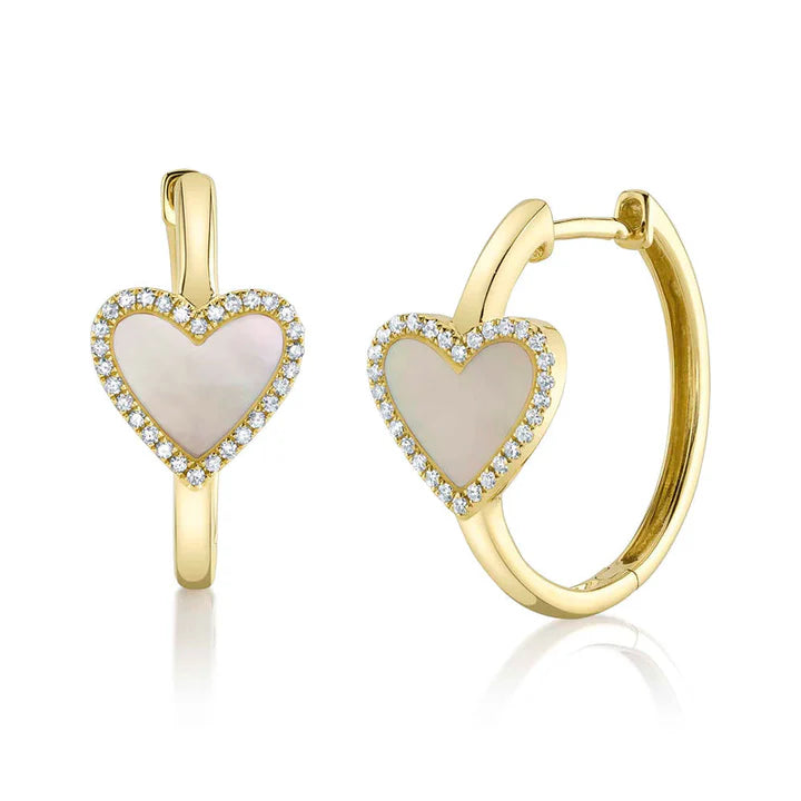 Gold heart-shaped earrings with a white center and diamond accents on a white background