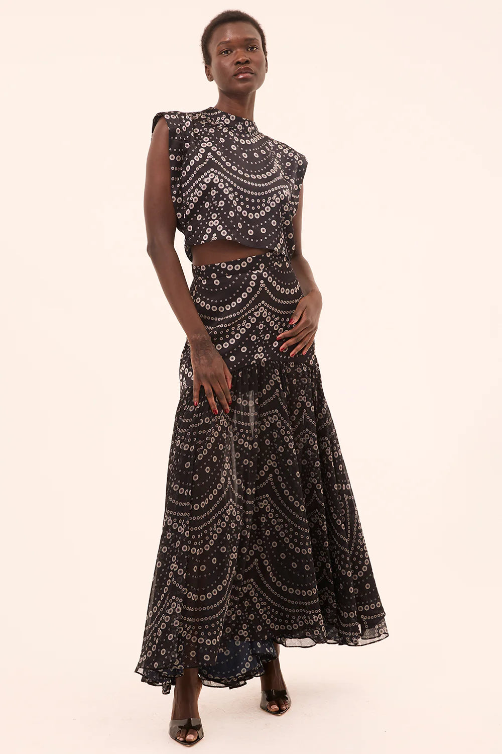 inah stranded pearls top with yara skirt on a model with a cream background