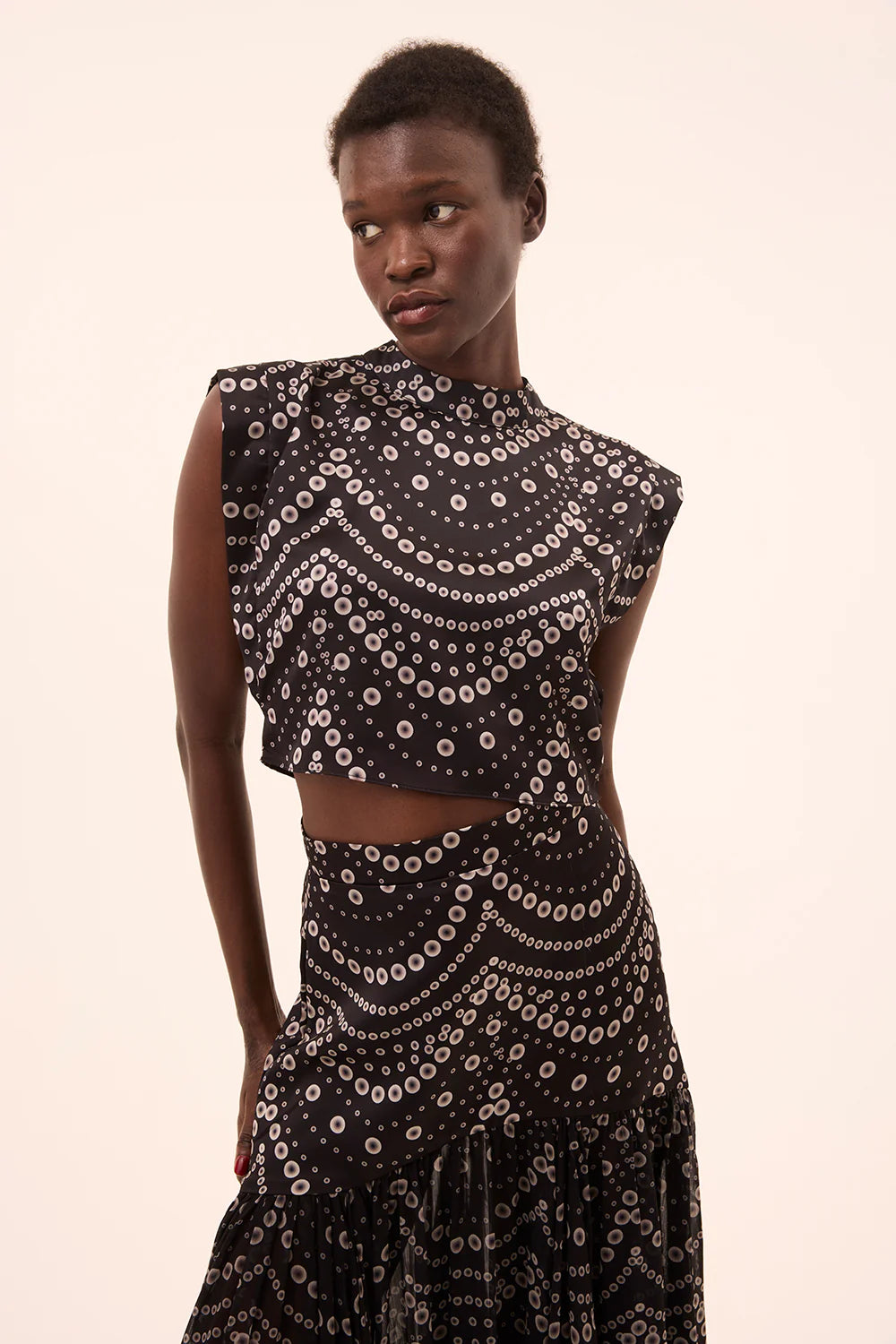 inah stranded pearls top with yara skirt on a model with a cream background