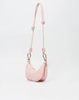 Pink handbag with a strap on a light gray background