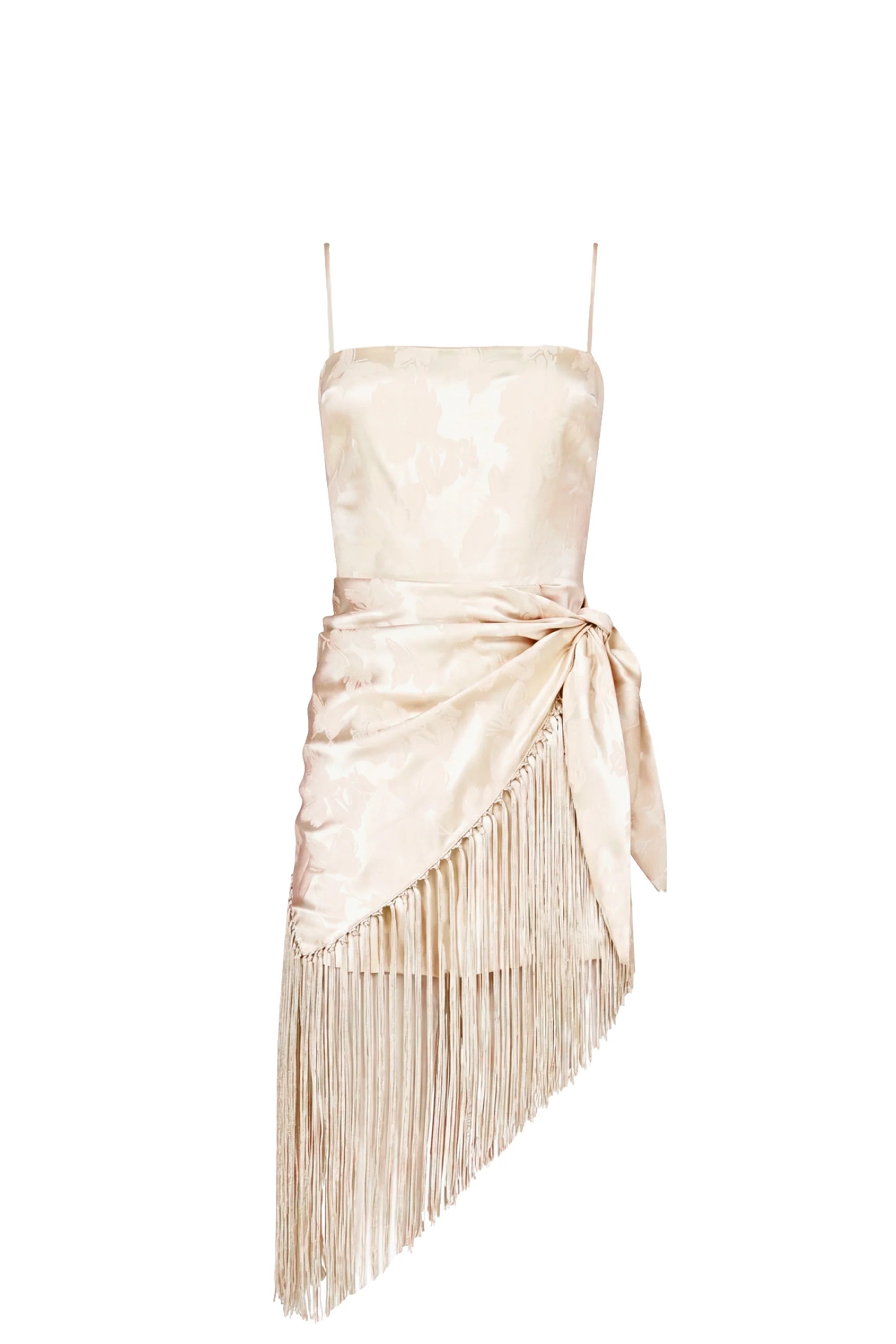 Photo of a wearing a cream colored romper with fringe scarf detail on a white background