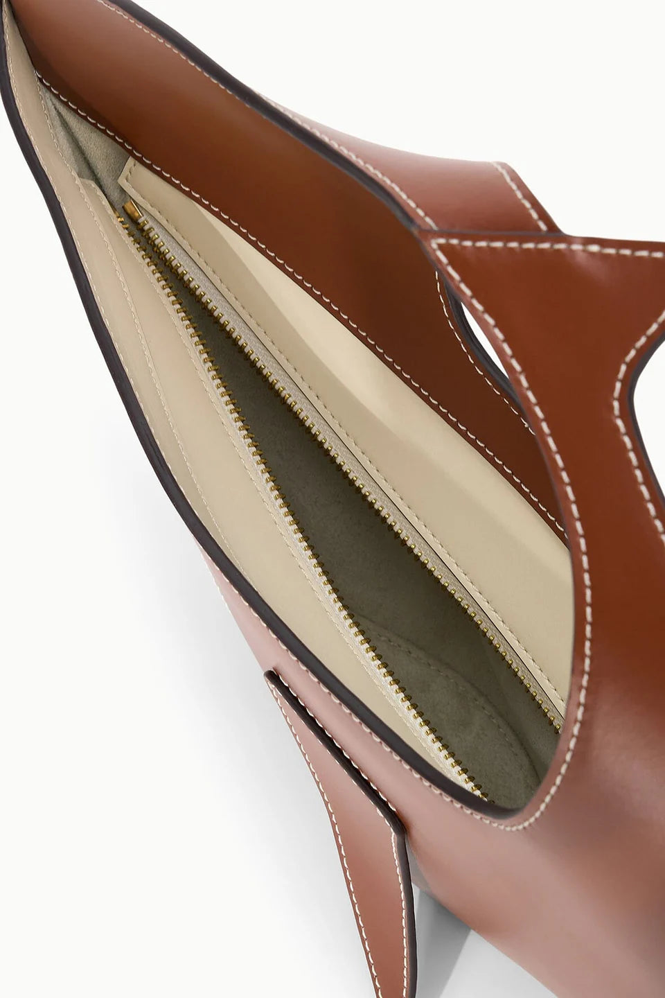 Close-up of a Brown shark-shaped handbag on a white background