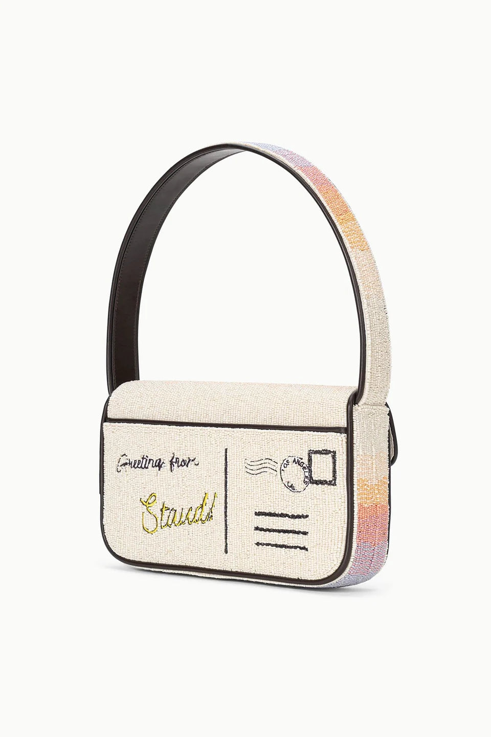 Handbag designed like a vintage postcard with rainbow handle on a white background