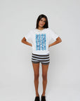 model wearing beachside summers short sleeve tee with stripe shorts on a white background