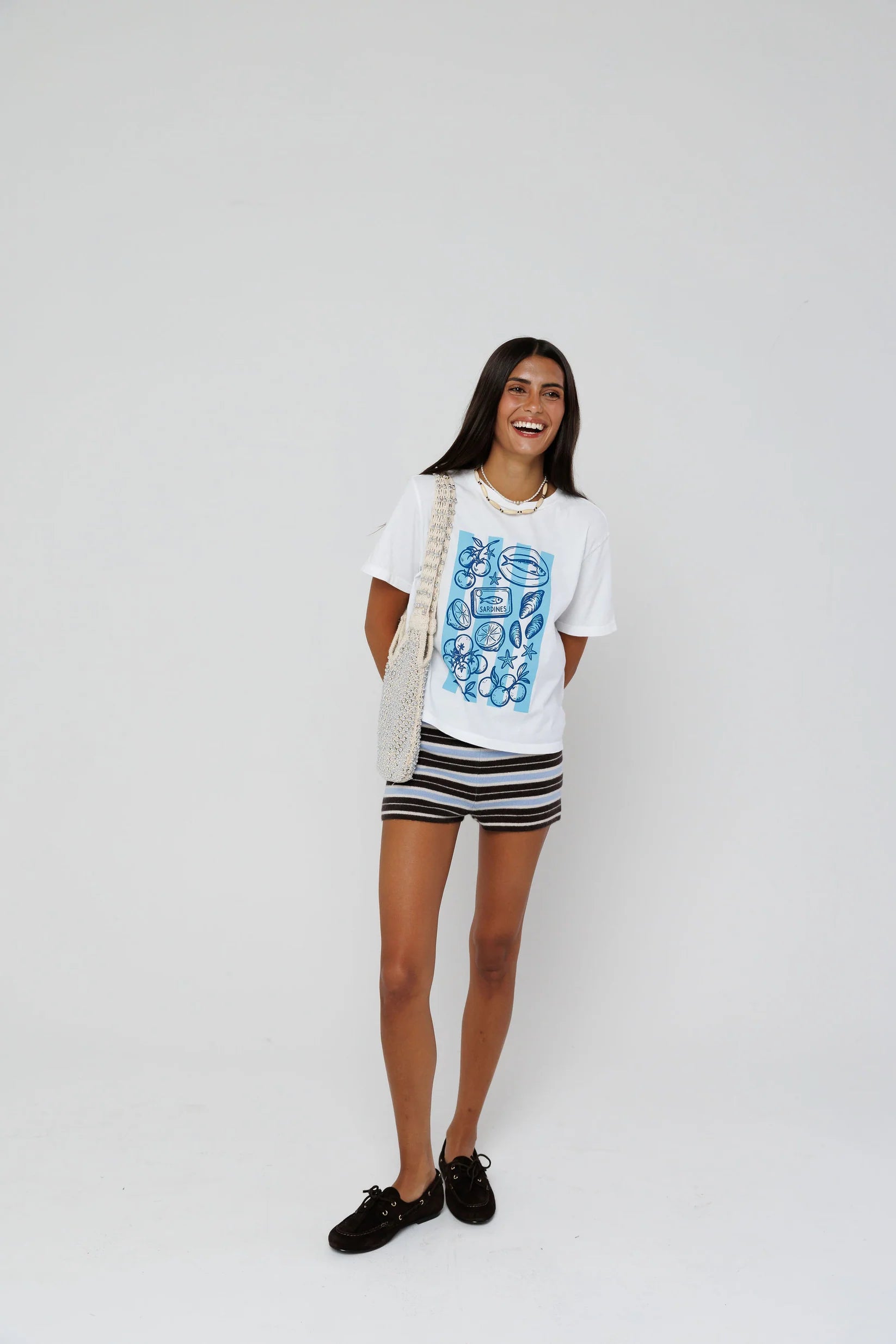 model wearing beachside summers short sleeve tee with stripe shorts on a white background