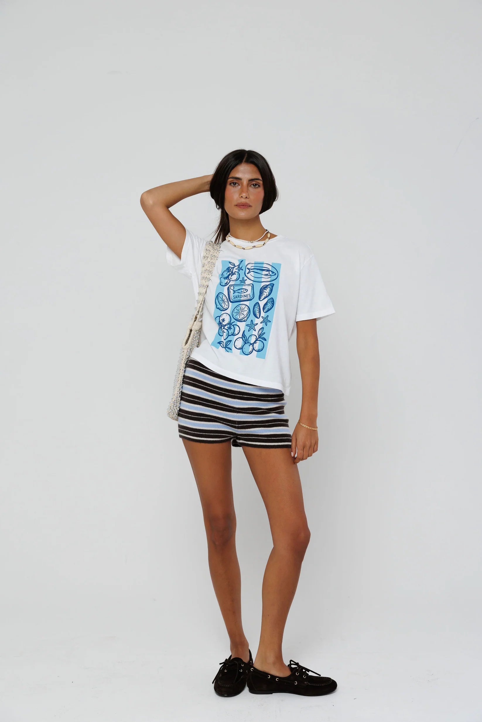 model wearing beachside summers short sleeve tee with stripe shorts on a white background