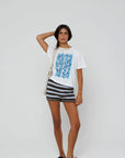 model wearing beachside summers short sleeve tee with stripe shorts on a white background