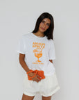 model wearing amalfi spritz short sleeve tee with white shorts on a white background