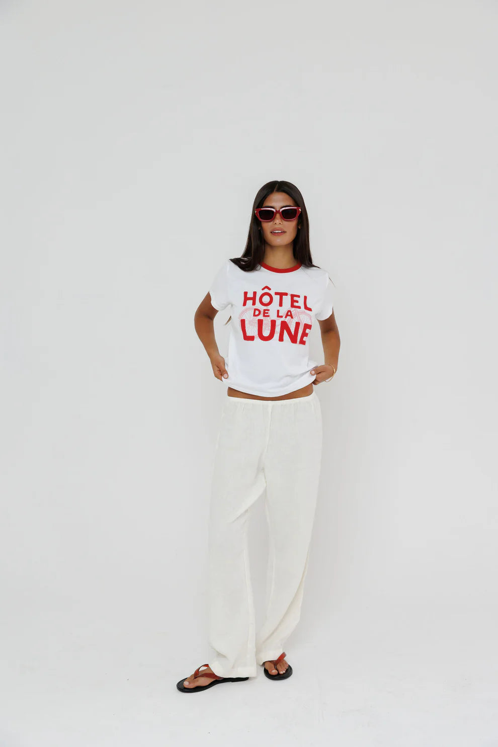 Hotel De La Lune Ringer Tee full body front view on model with hands grabbing bottom of shirt