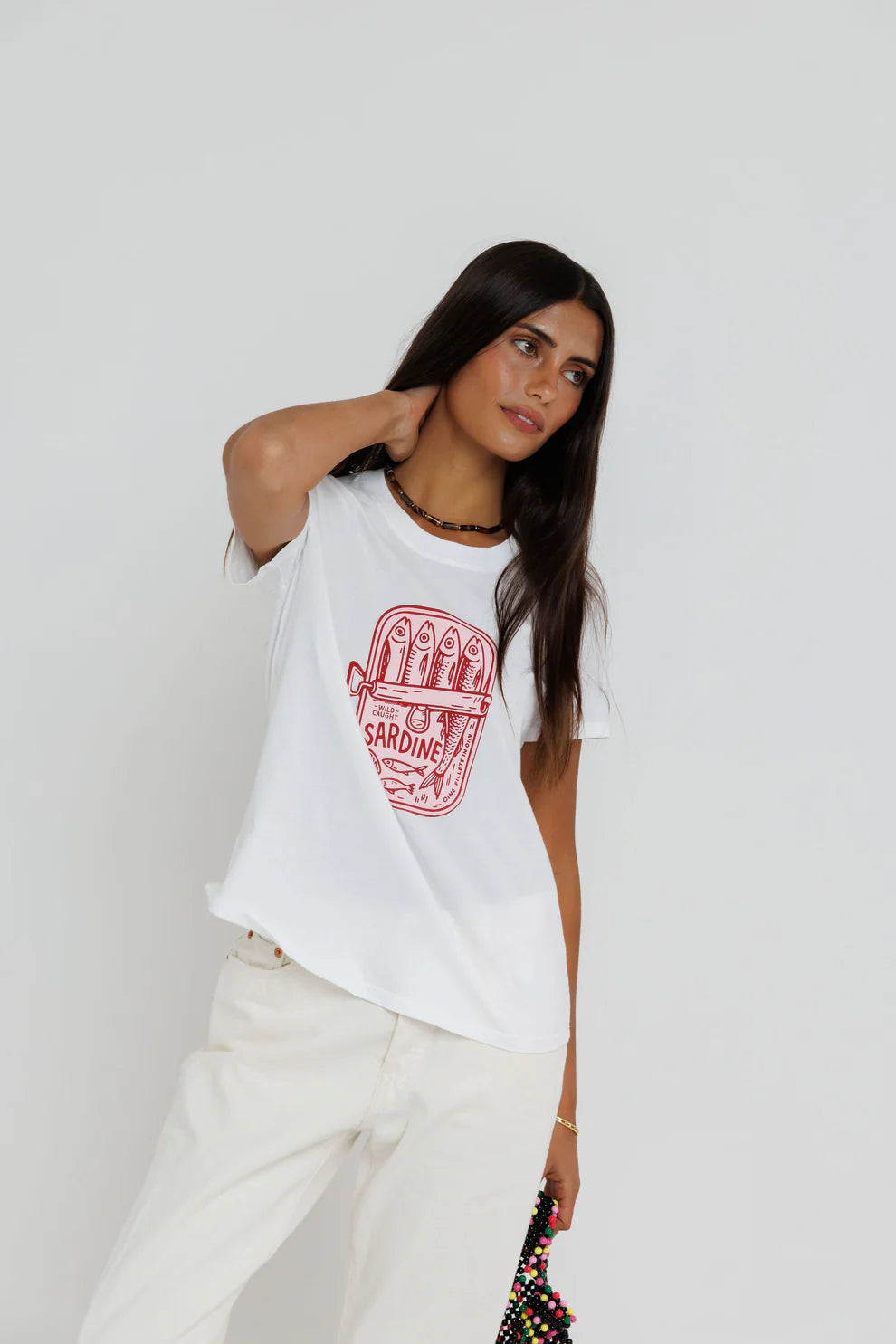 Sardine Summer Femme Crew close up front view on model posing with hand behind her neck
