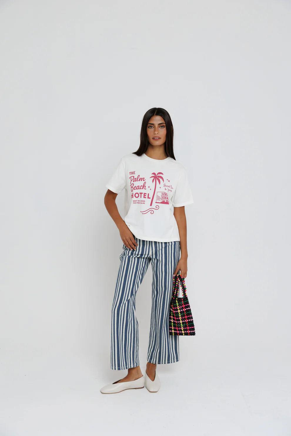 Palm Beach Hotel Tee full body front view on model with arm on waist