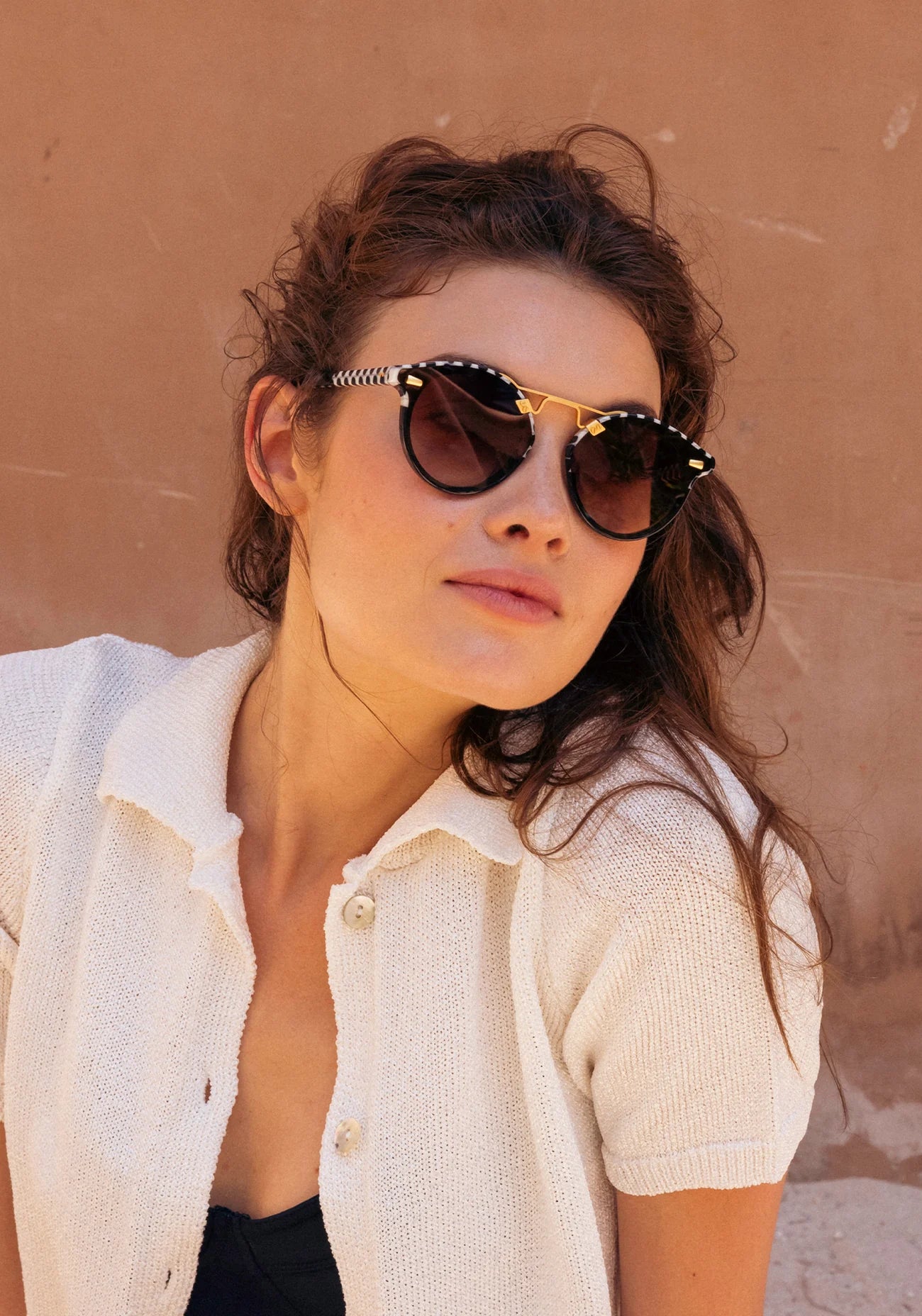 STL Nylon Domino to Black 24k Sunglasses on model with average oval face shape