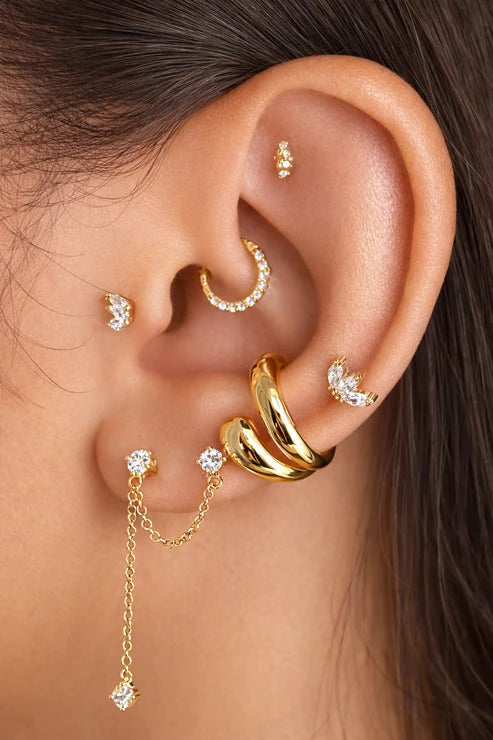 Era Studs on model's ear surrounded by other earrings