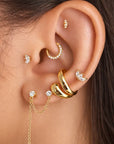 Era Studs on model's ear surrounded by other earrings