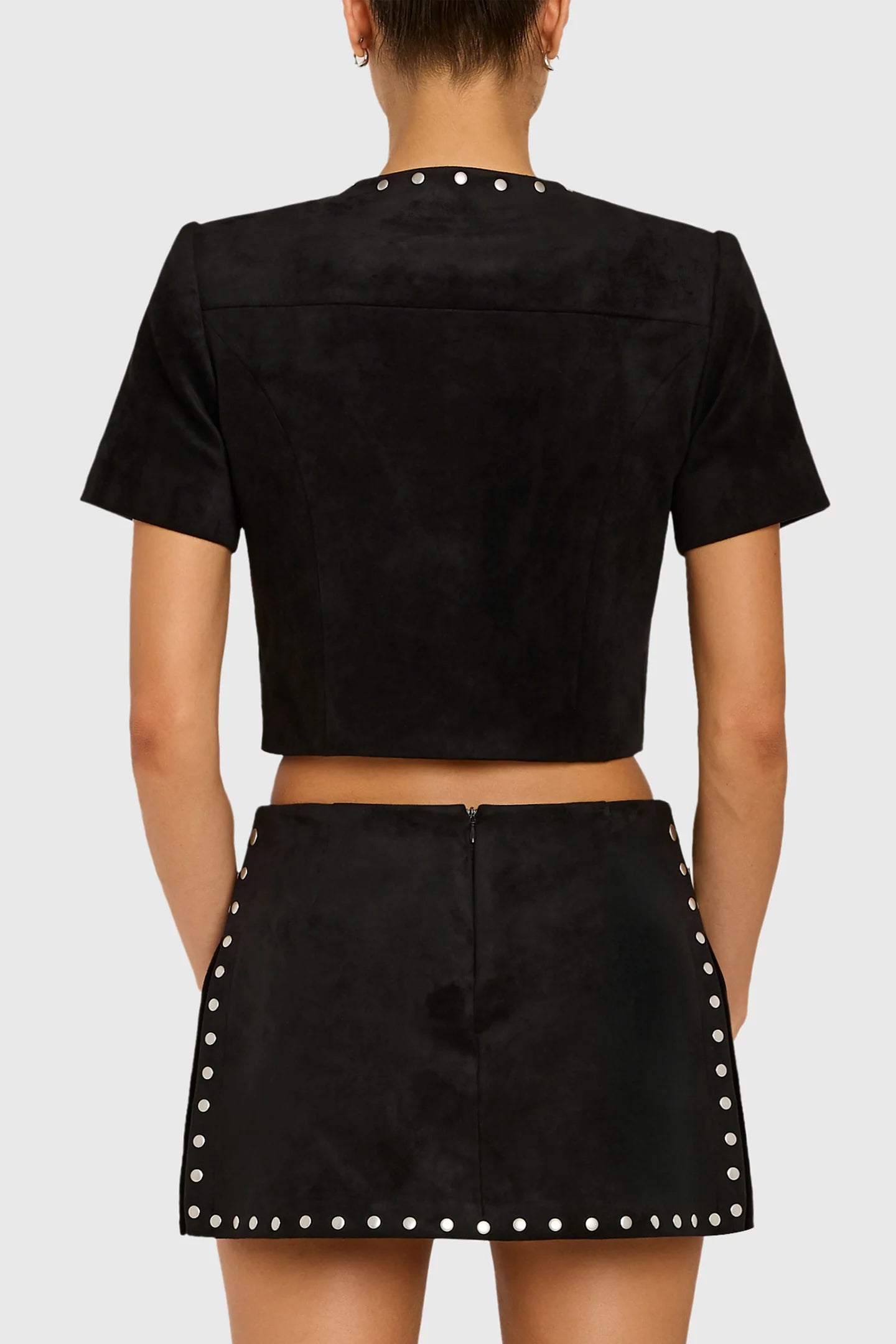 Model wearing studded black shirt