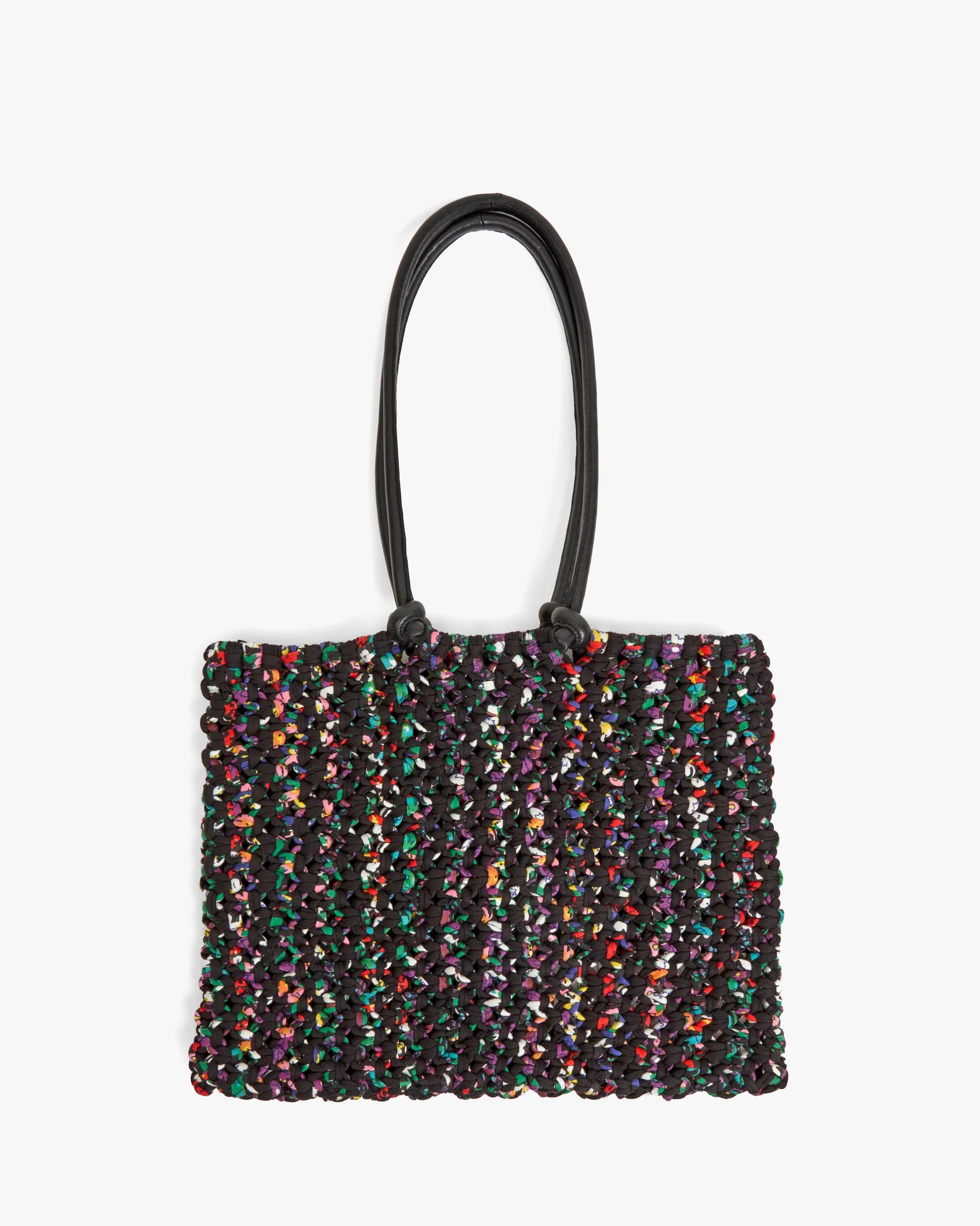 Multicolored textured handbag with a black handle on a white background