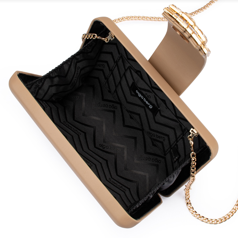Beige handbag with black interior and gold chain strap on a white background