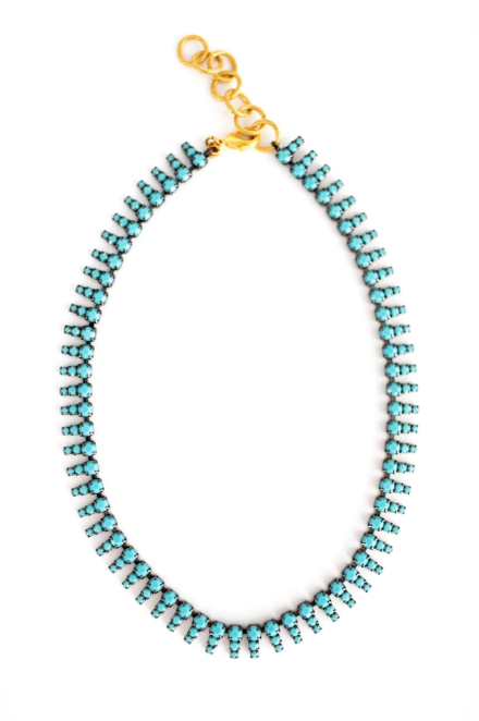 Turquoise beaded necklace with a gold clasp on a white background