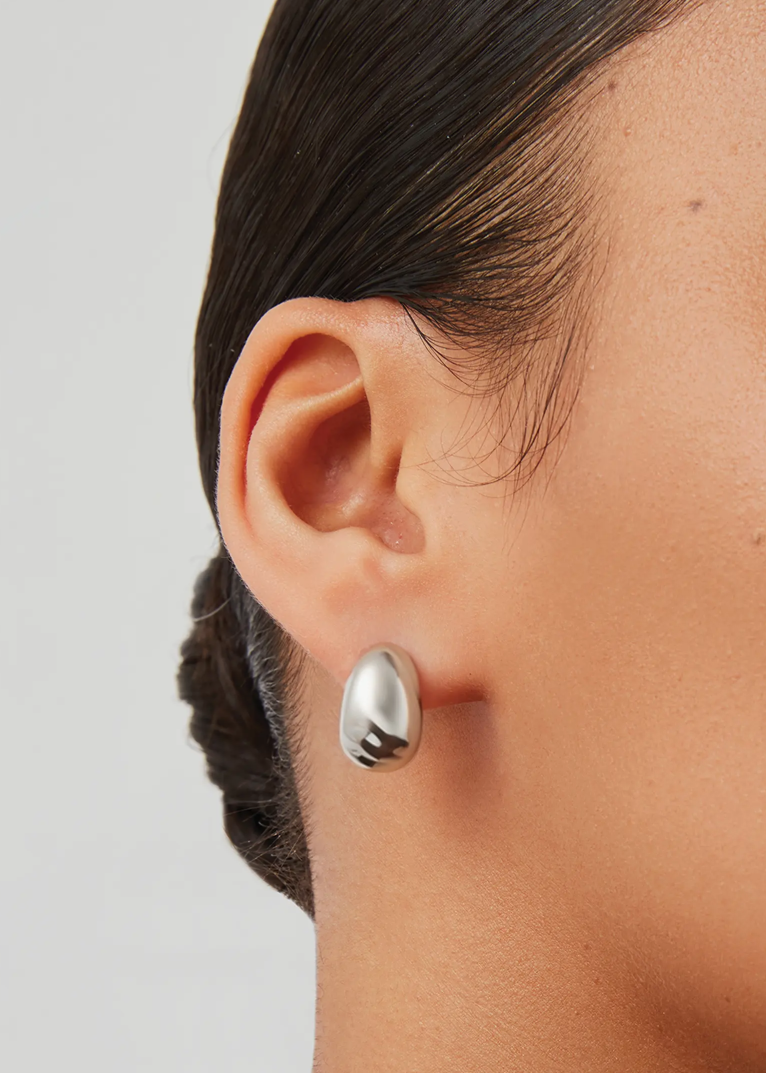 Nelle Hoops Silver close up on ear