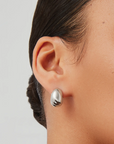 Nelle Hoops Silver close up on ear