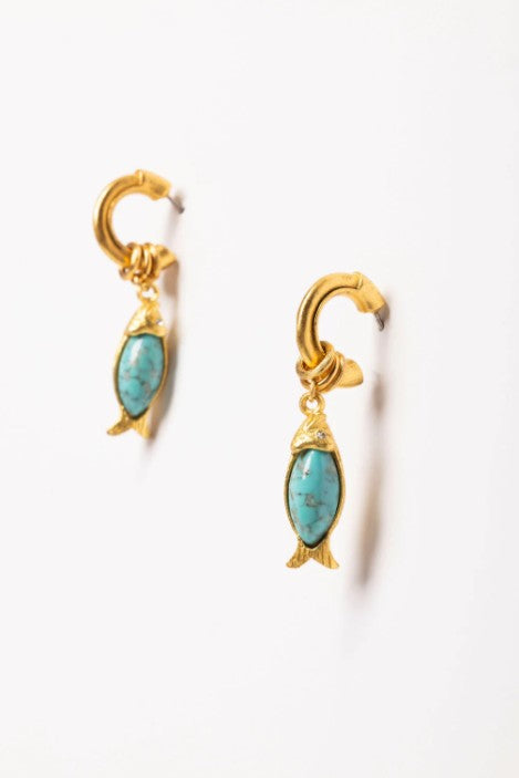 Gold earrings with turquoise stones on a white background