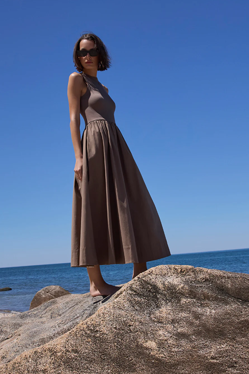 The RSVP Dress, model standing on rock