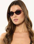 Solange Sunglasses Scarlet Chroma + Bordeaux on model with average, oval face shape