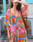 Woman wearing a colorful patterned dress with a blurred background, close up