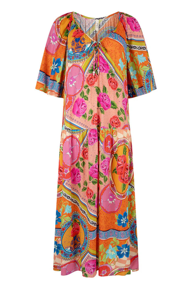 Colorful dress with floral and abstract patterns on a white background, front