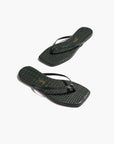 Pair of black flip-flops on a white background