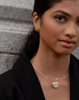 Quinn Hoop Earrings front and partial side view on model