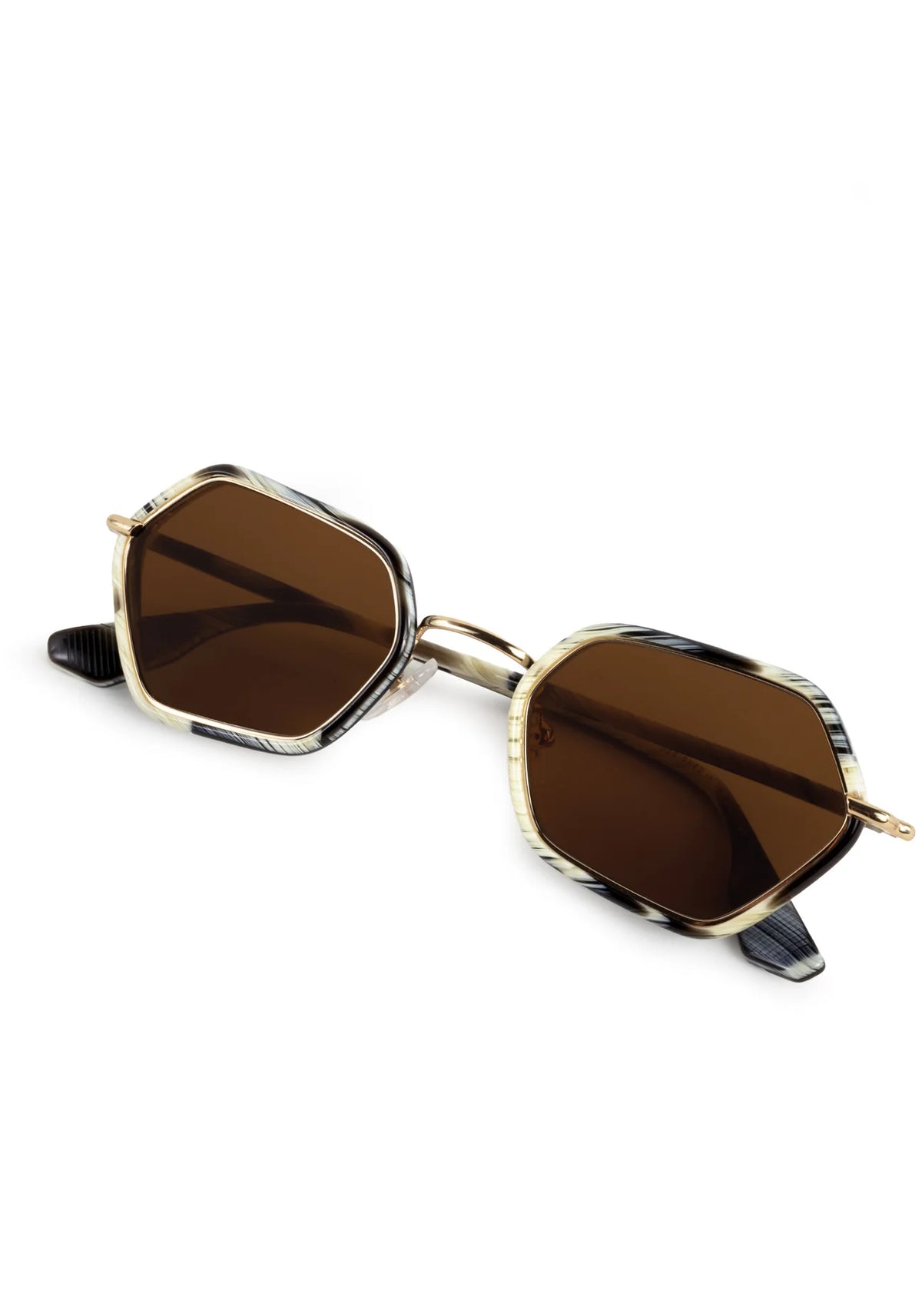 Hexagonal sunglasses with dark brown lenses, gold metal rims, and tortoiseshell-patterned acetate arms on a white background.