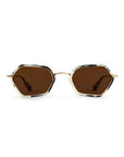 Hexagonal sunglasses with dark brown lenses, a gold metal bridge, and a tortoiseshell frame with black, brown, and beige tones, shown against a plain white background.