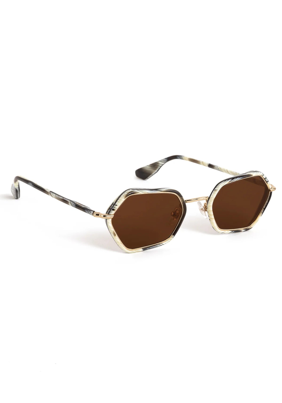Hexagonal sunglasses with brown tinted lenses, a gold metal frame, and tortoiseshell-patterned temples on a white background.