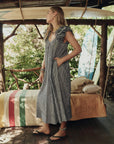 The Ruffle Coverup Black and Cream Check side, hand in pocket