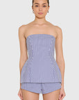 model wearing a strapless top and short set in blue and ivory stripes