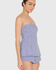 model wearing a strapless top and short set in blue and ivory stripes