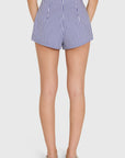 model wearing blue and ivory striped shorts on a white background, back view