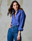 Amita Stripe Top close up, tucked in jeans