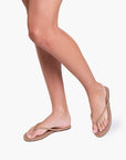 Tubular Lily Sandal in Cocobutter on model who appears to be in walking stance