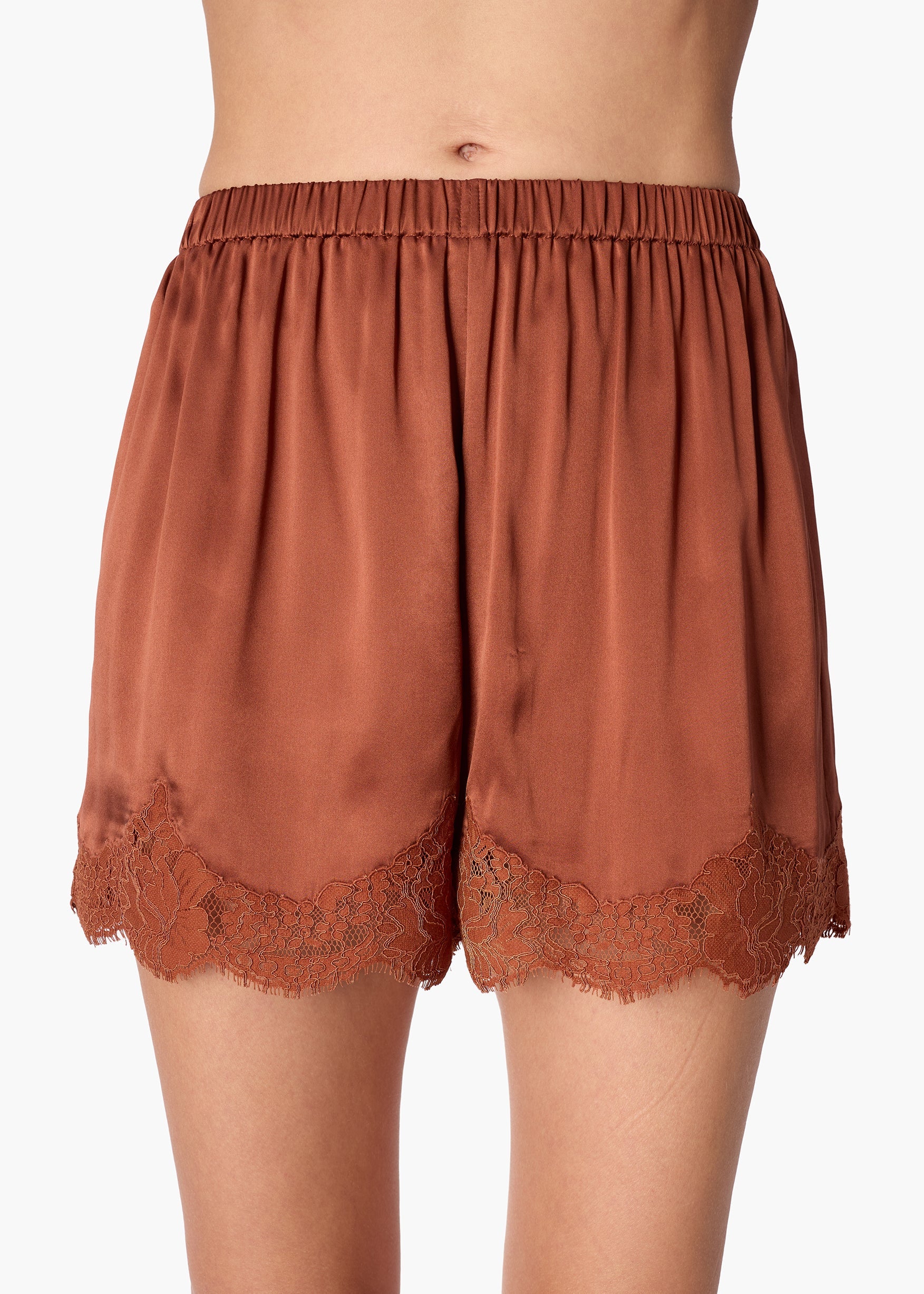 Brown satin shorts with lace trim on a white background