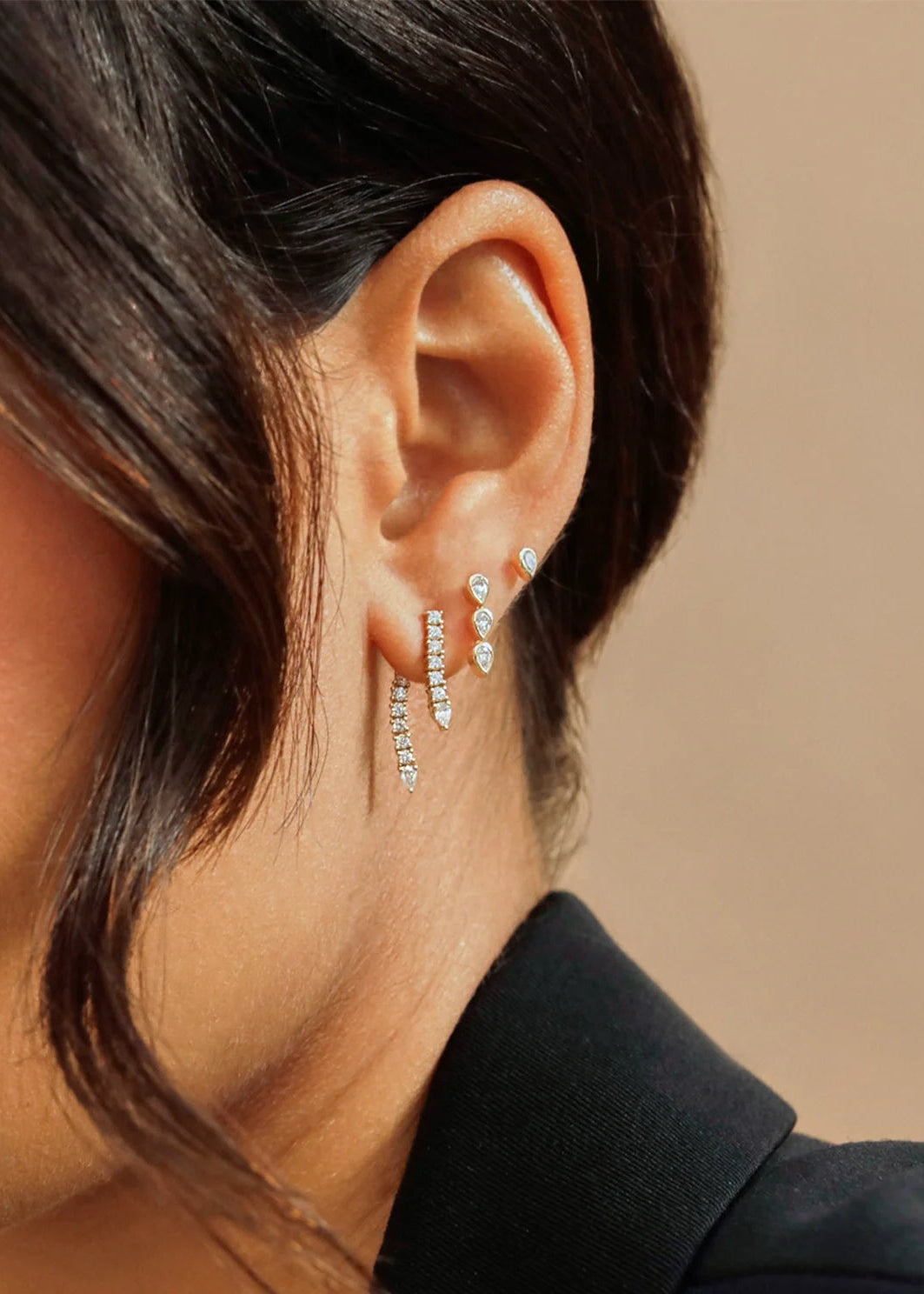 Single Diamond Teardrop Fringe Earring on model in first hole