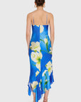 model wearing a blue dress with white flowers on a white background, back view