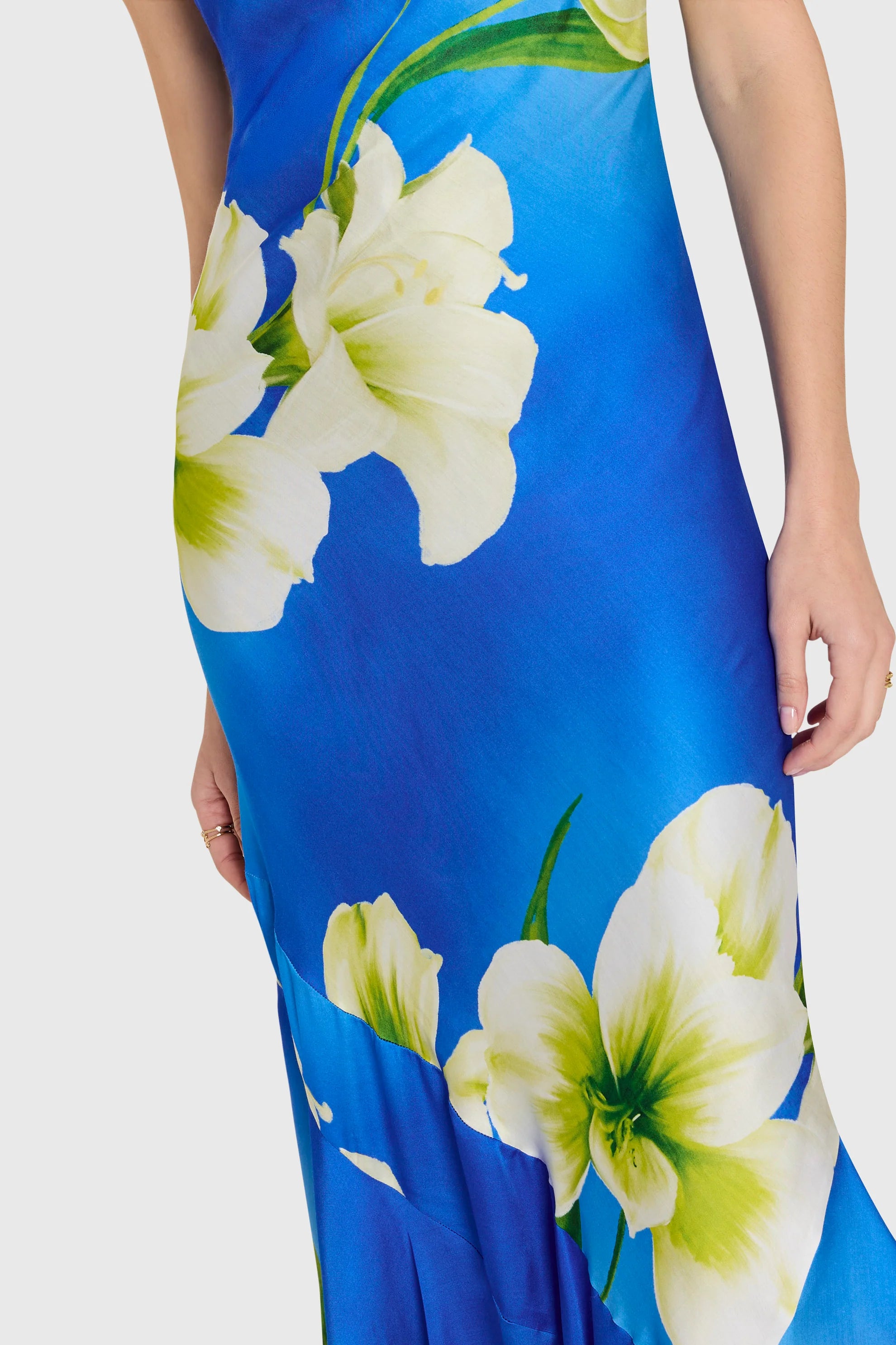 detail view of a blue dress with white flowers