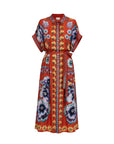 A vibrant red kaftan dress featuring a colorful floral and geometric print, with a matching tie belt at the waist, shown against a plain white background.